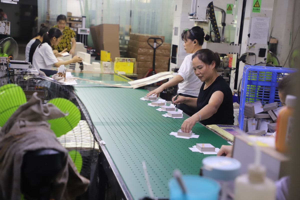 custom rigid box assembly and quality inspection on factory line