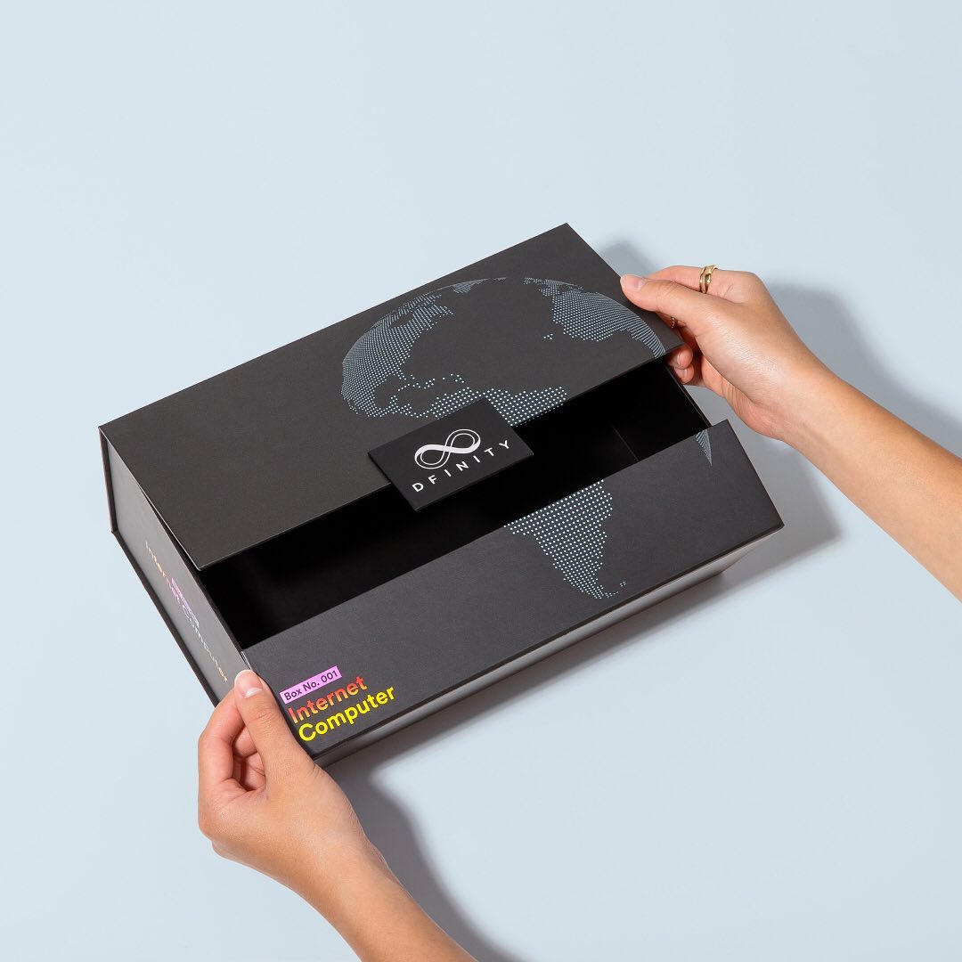 Black custom hinged presentation box opened to show its wide lid and compartmented interior.