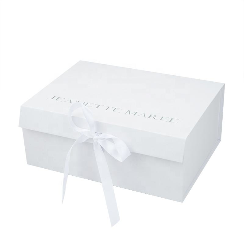 White custom gift box with a matching white ribbon tied at the front.