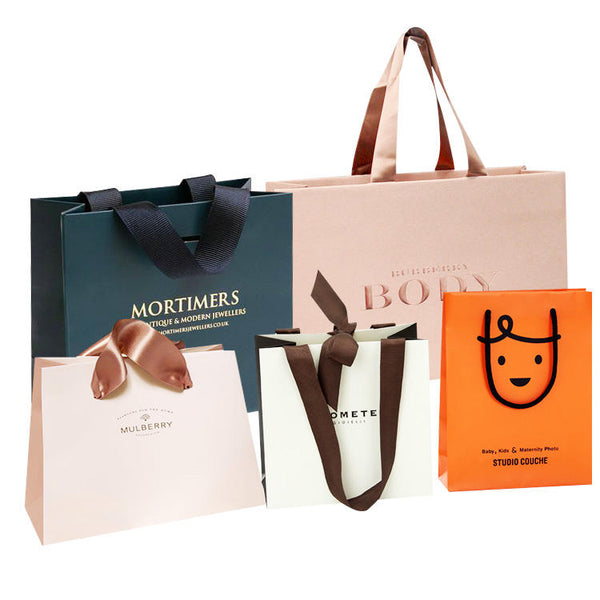Lionwrapack paper bag for clothes pink matte garment clothing boutique packaging bags with ribbon handles